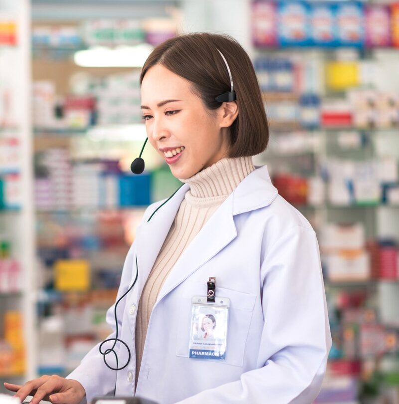 Pharmacist with headset ready to take calls — 24/7 clinical support